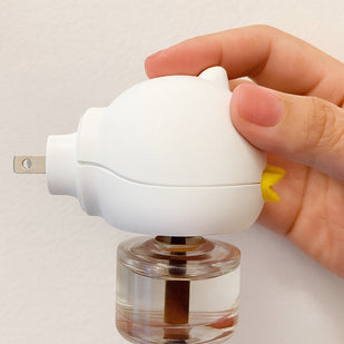 Insert the diffuser into the outlet, ensuring the bottle remains upright.